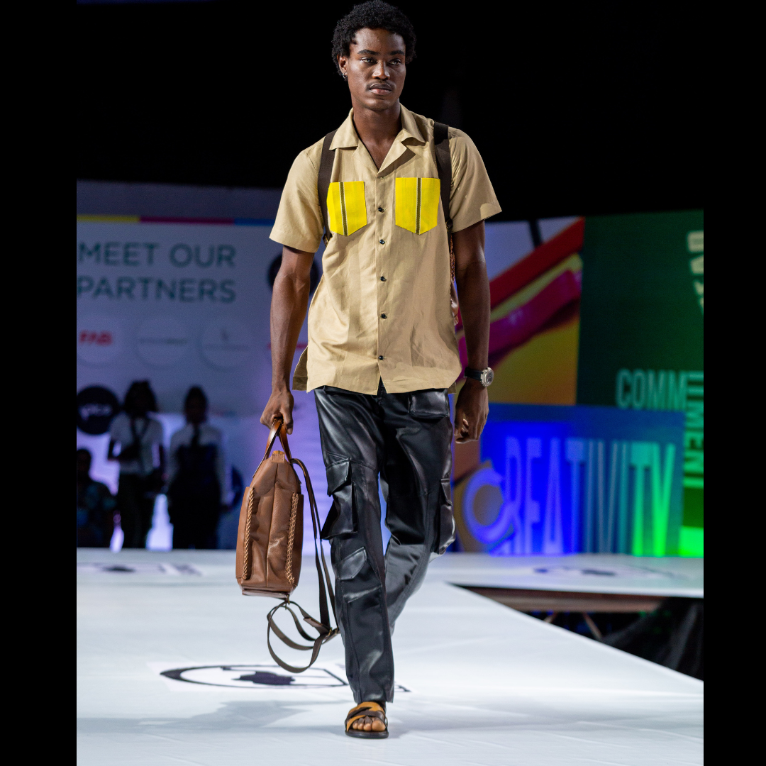 A male model walking on the runway of Lagos Leather Fair 2023