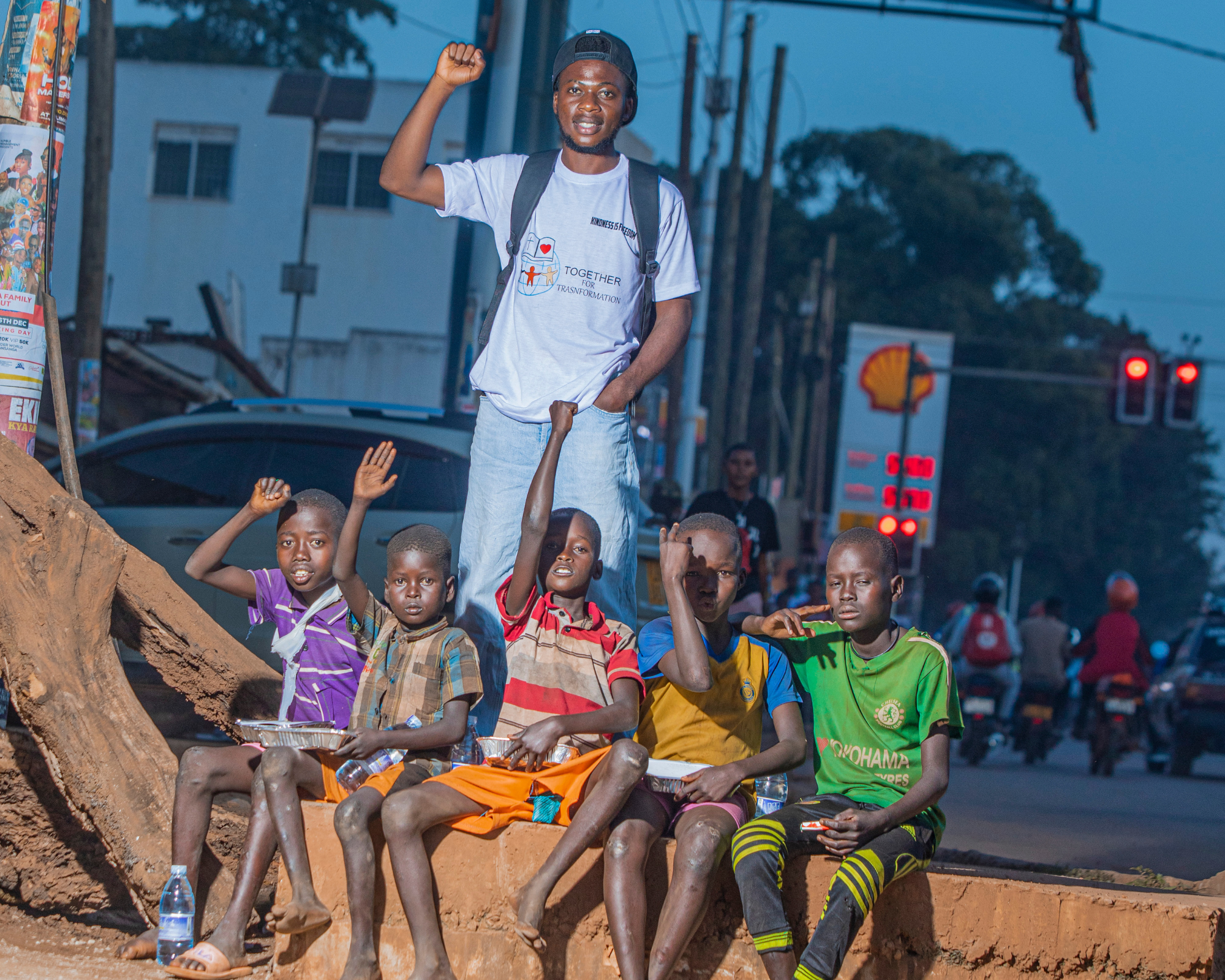 Homeless Children in Uganda being fed by Shabani Chani