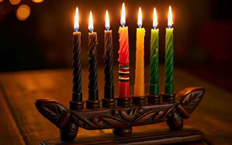 Kinara with seven candles lit for Kwanzaa celebration